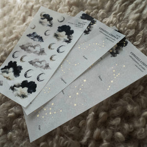 Aura Estelle Washi Stickers Moon and Constellations washi sticker sheets fanned on textured fabric