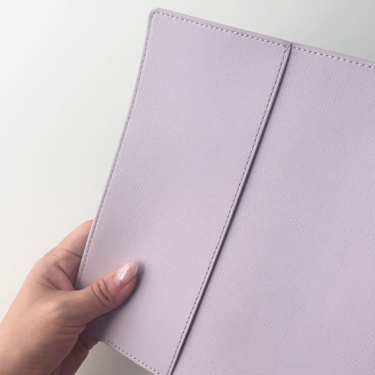 Lilac B6 SKIN planner cover held in hand, showing the back panel