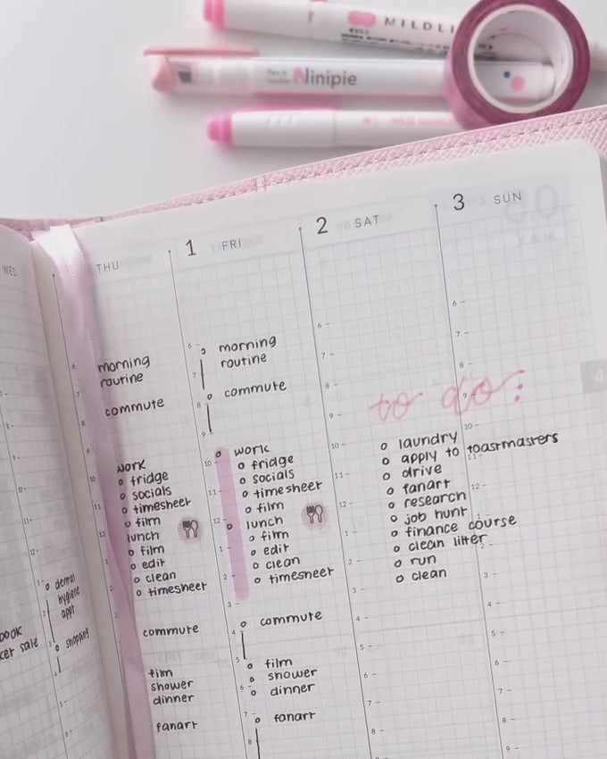 A planned weekly spread on Tomoe River paper with pink highlighters and washi tape